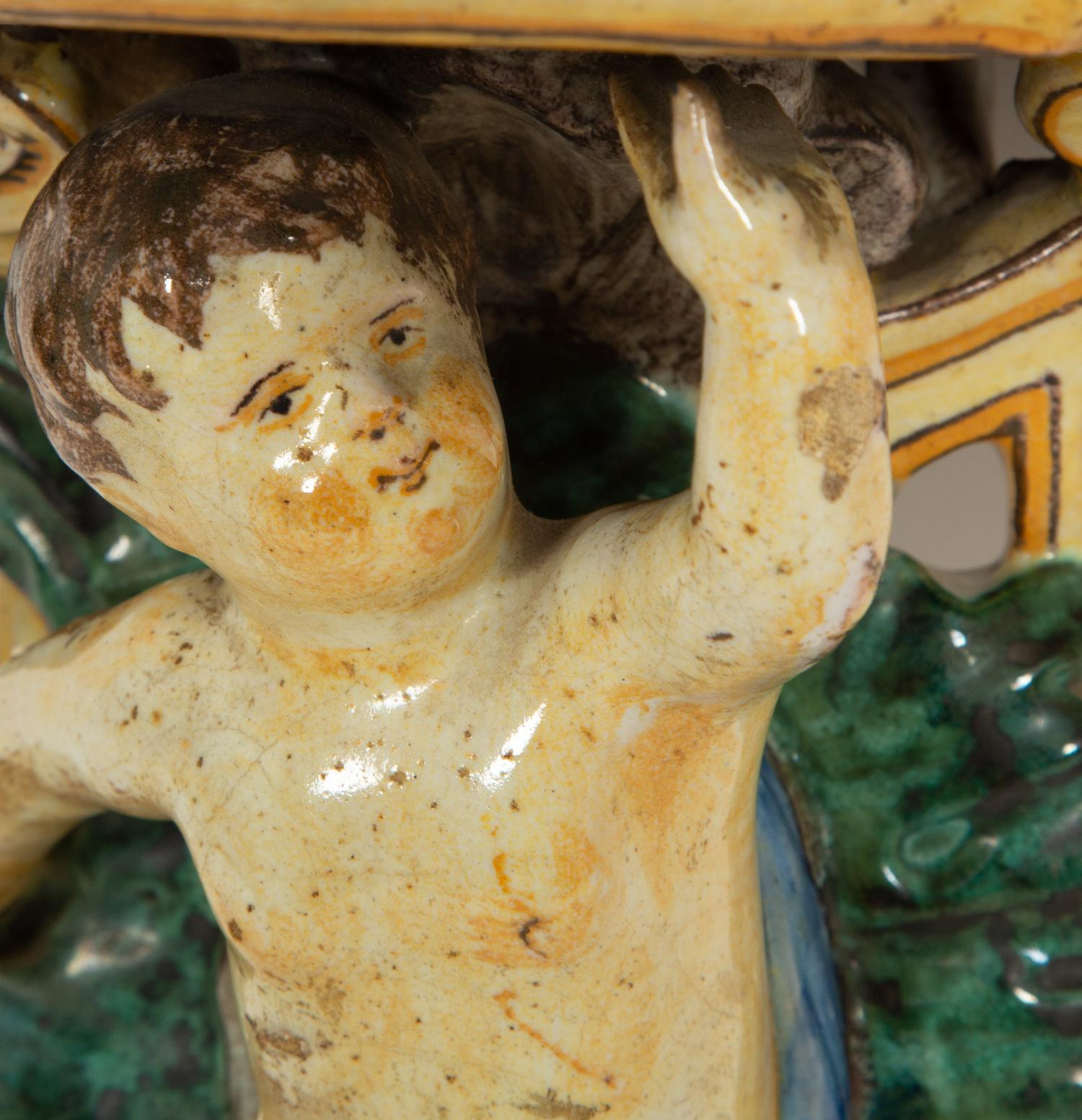 A Pair of Tin-Glazed Earthenware Wall Brackets, and Two Giltwood Wall Brackets