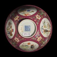 A Chinese Famille-Rose Ruby-Ground Sgraffito 'Medallion' Bowl, Daoguang Mark and of the Period — 清道光 內青花外粉彩軋道胭脂紅地開光五穀豐登博古紋碗