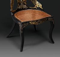 Two Victorian Black Lacquered Parcel-Gilt and Mother-of-Pearl Inlaid Cane Upholstered Slipper Chairs