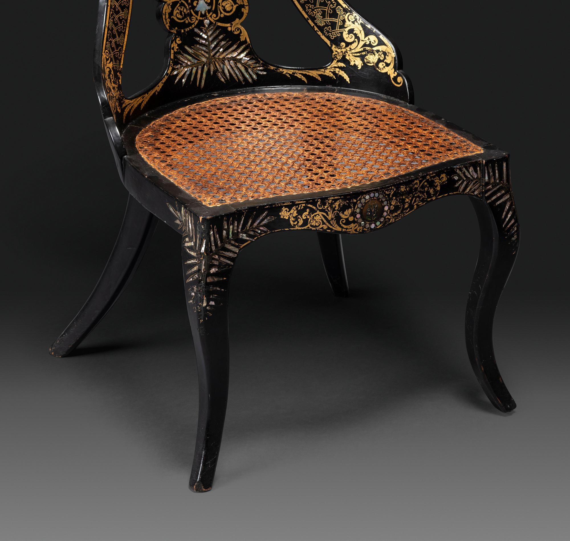 Two Victorian Black Lacquered Parcel-Gilt and Mother-of-Pearl Inlaid Cane Upholstered Slipper Chairs