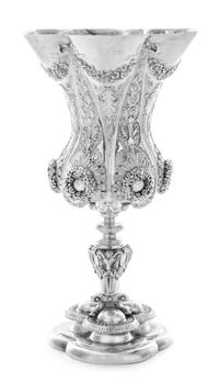 A George IV Silver Chalice, Benjamin Smith II, London, 1828, the hexafoil rim with repousse floral and ribbon swags above the paneled s