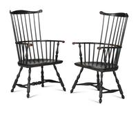 A Pair of Various Wood Black Painted Volute and Knuckle Carved Comb-Back Windsor Armchairs