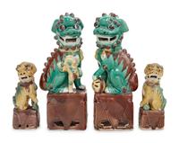 Two Pairs of Chinese Sancai Glazed Porcelain Figures of Fu Lions