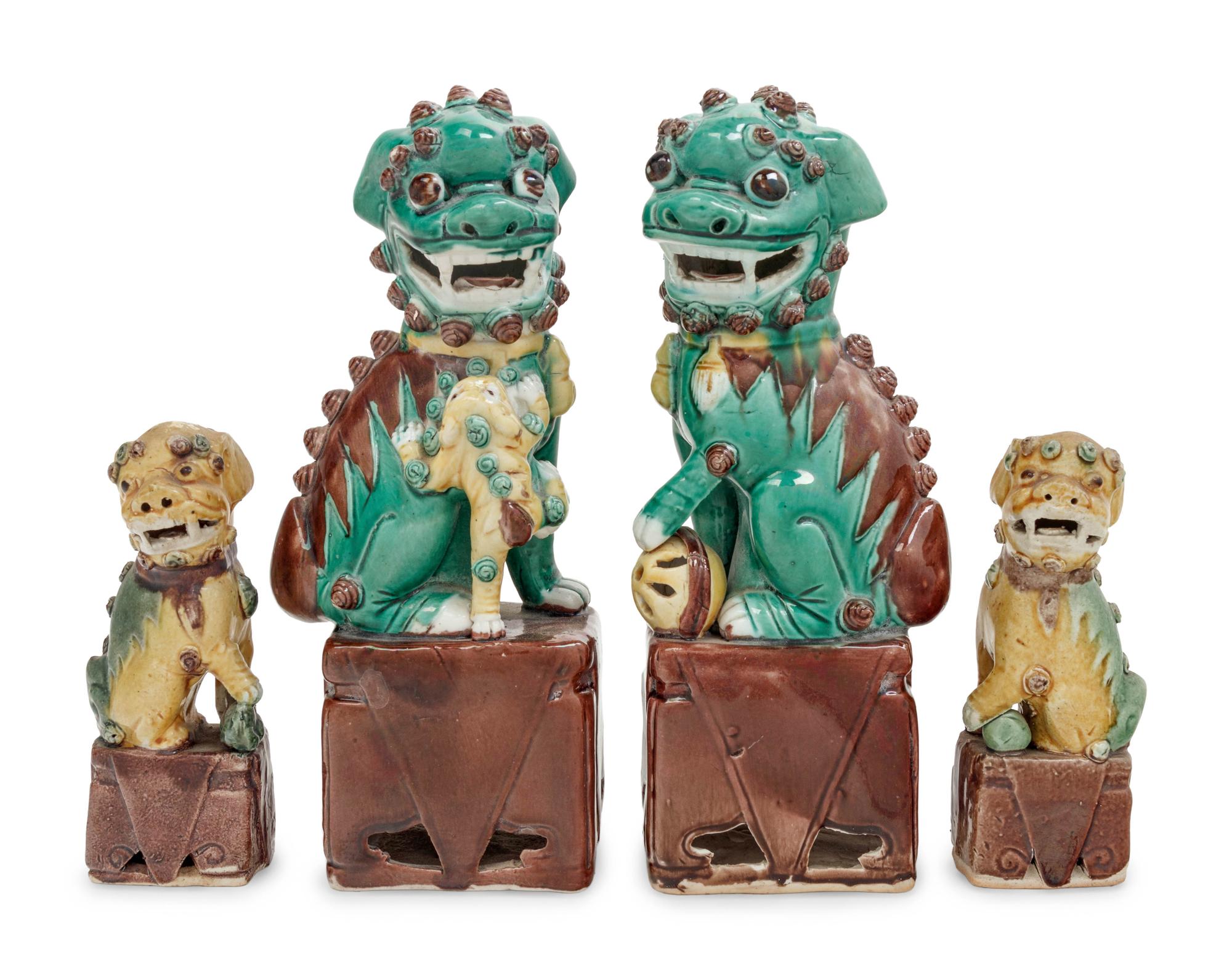 Two Pairs of Chinese Sancai Glazed Porcelain Figures of Fu Lions