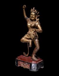 A Tibetan Gilt Lacquered Wood Figure of a Dancing Deity