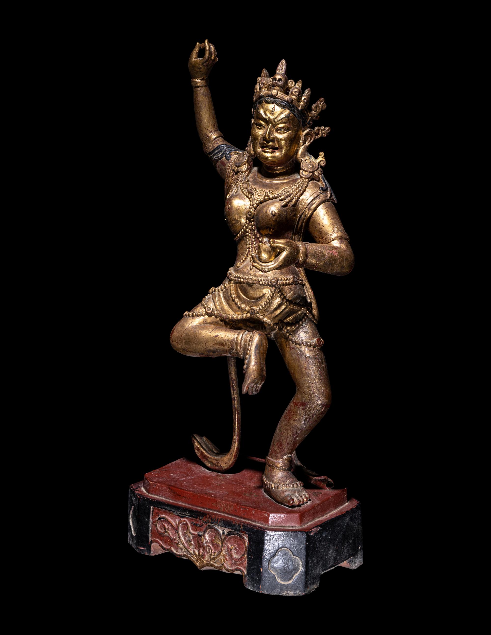 A Tibetan Gilt Lacquered Wood Figure of a Dancing Deity