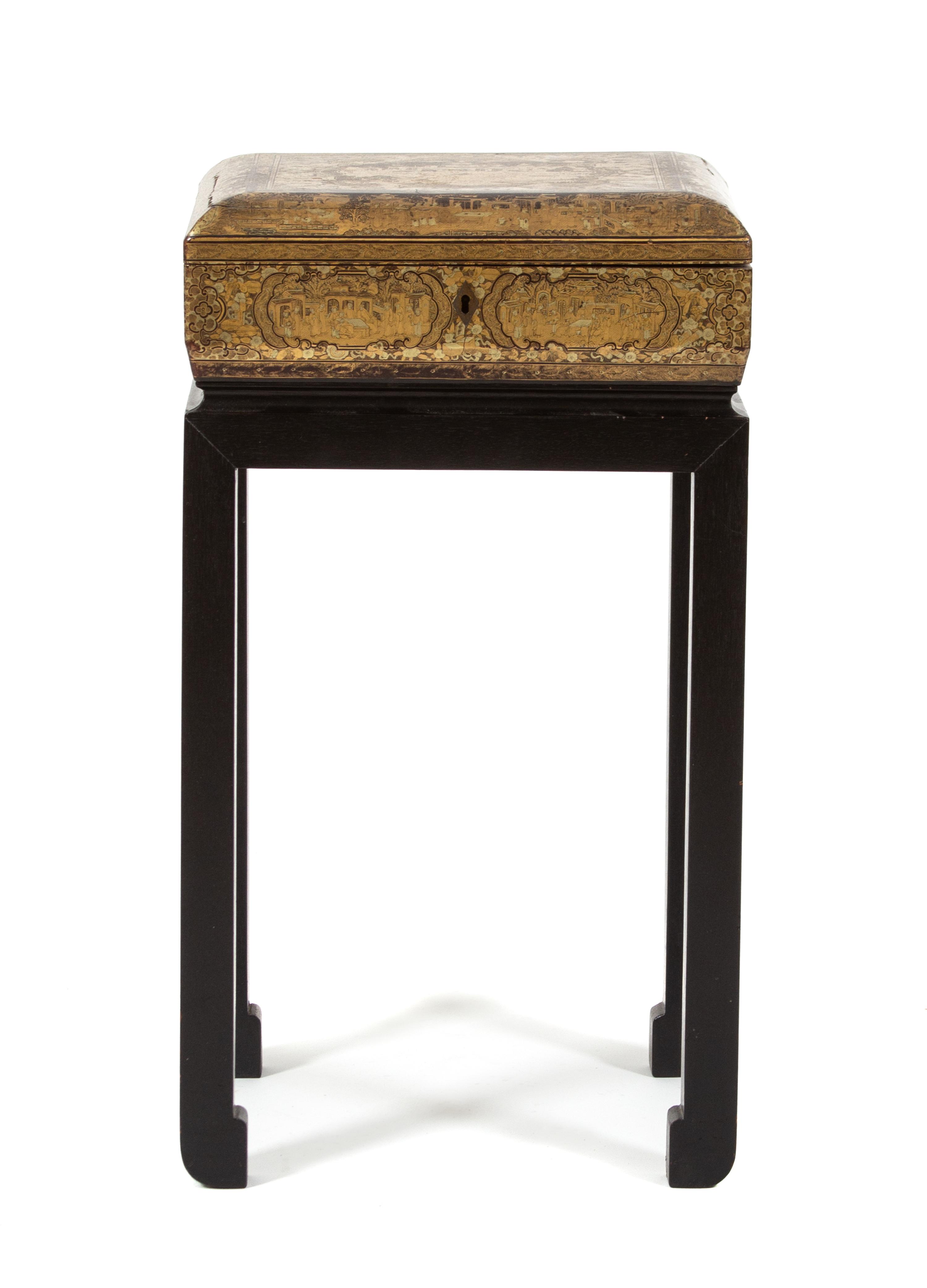 A Chinoiserie Brown and Gilt Lacquered Sewing Box on Stand Height overall 22 x width 12 x depth 10 inches. — 20TH CENTURY
