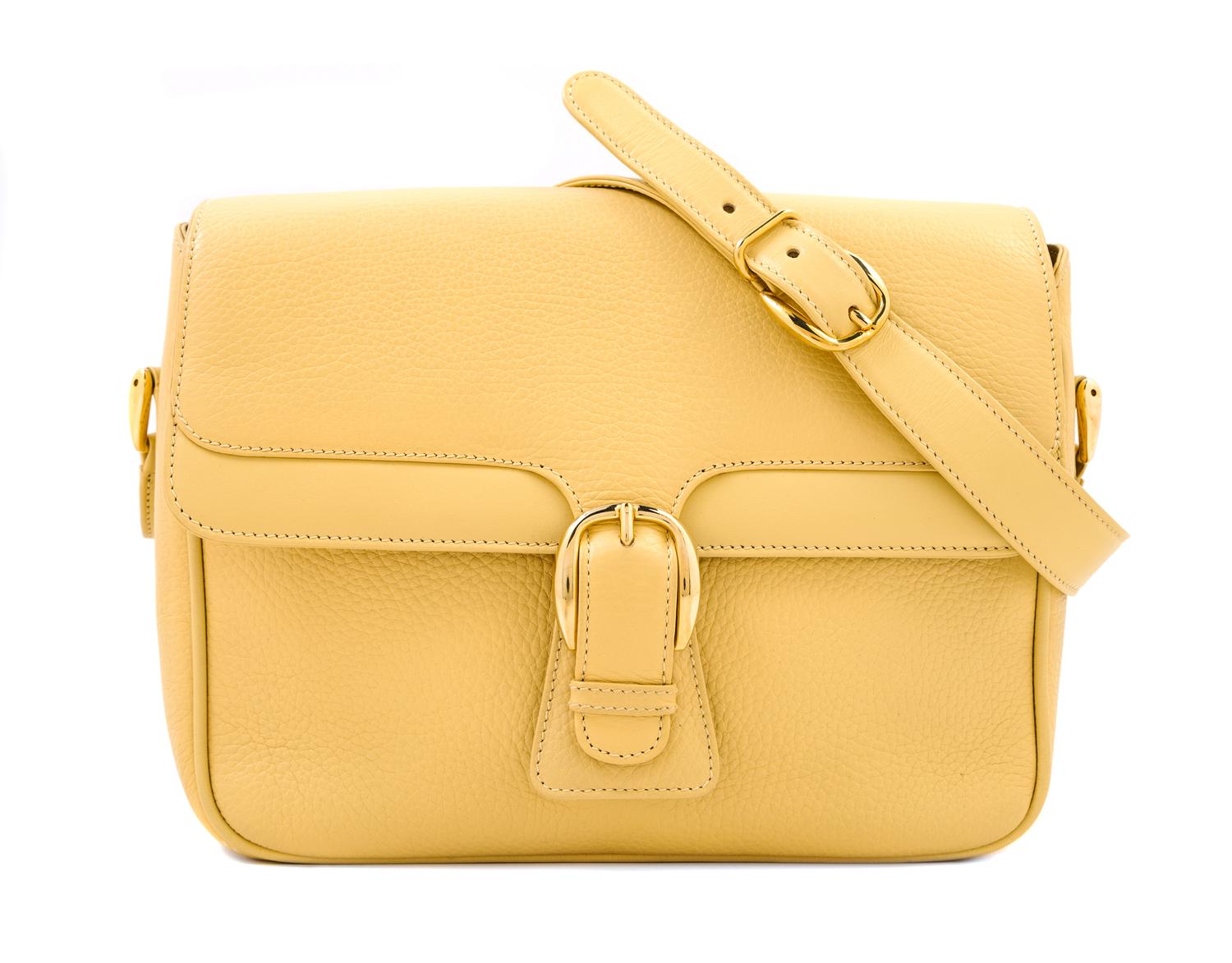 A Gucci Pale Yellow Leather Flap Handbag, 10" x 8" x 3"; Strap drop: 20".