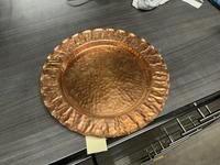 An Arts & Crafts Hammered Copper Plate