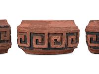 A Set of Four Continental Terra Cotta Ornaments