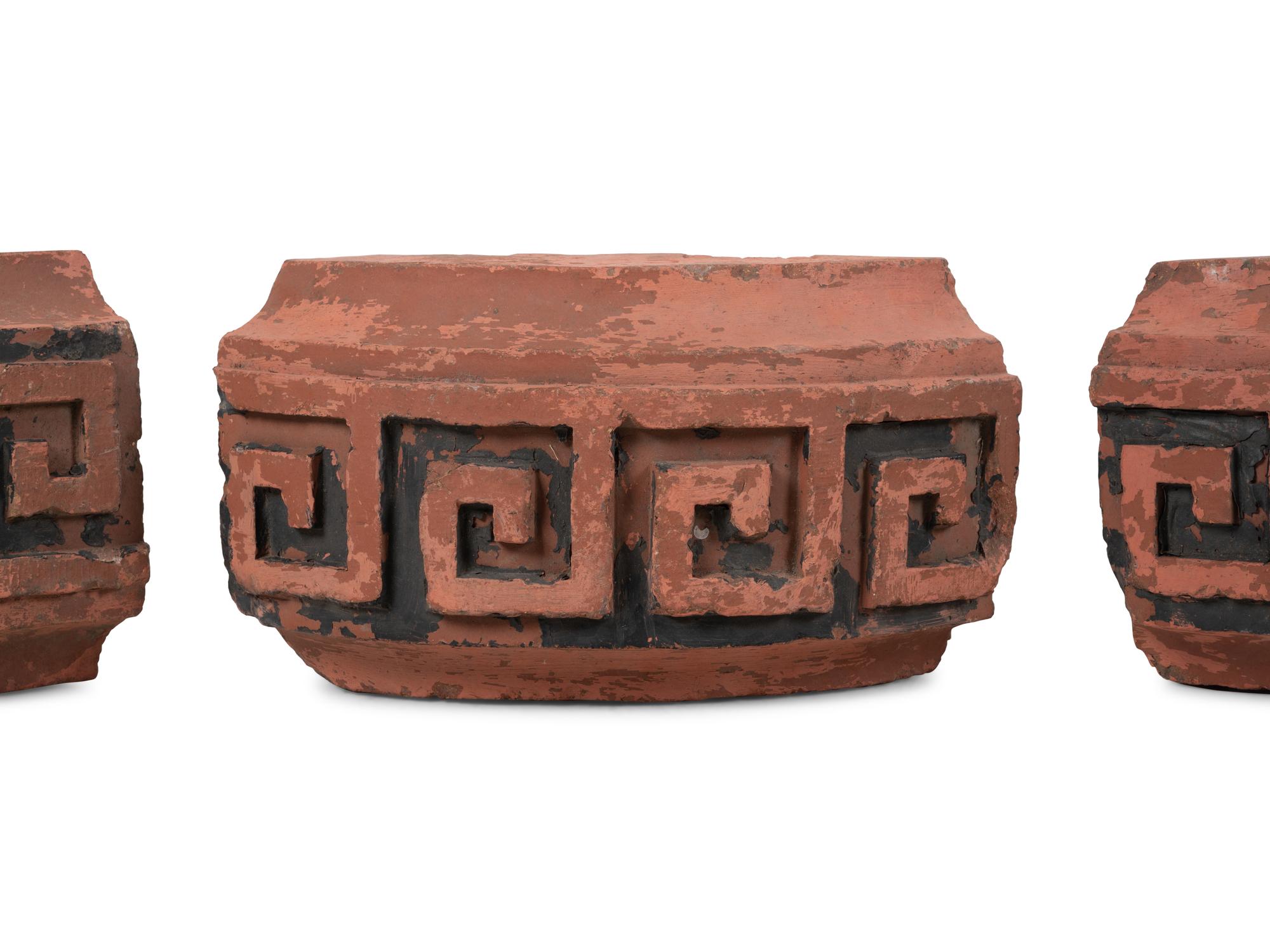 A Set of Four Continental Terra Cotta Ornaments