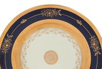 A Set of Twelve Limoges Porcelain Chargers