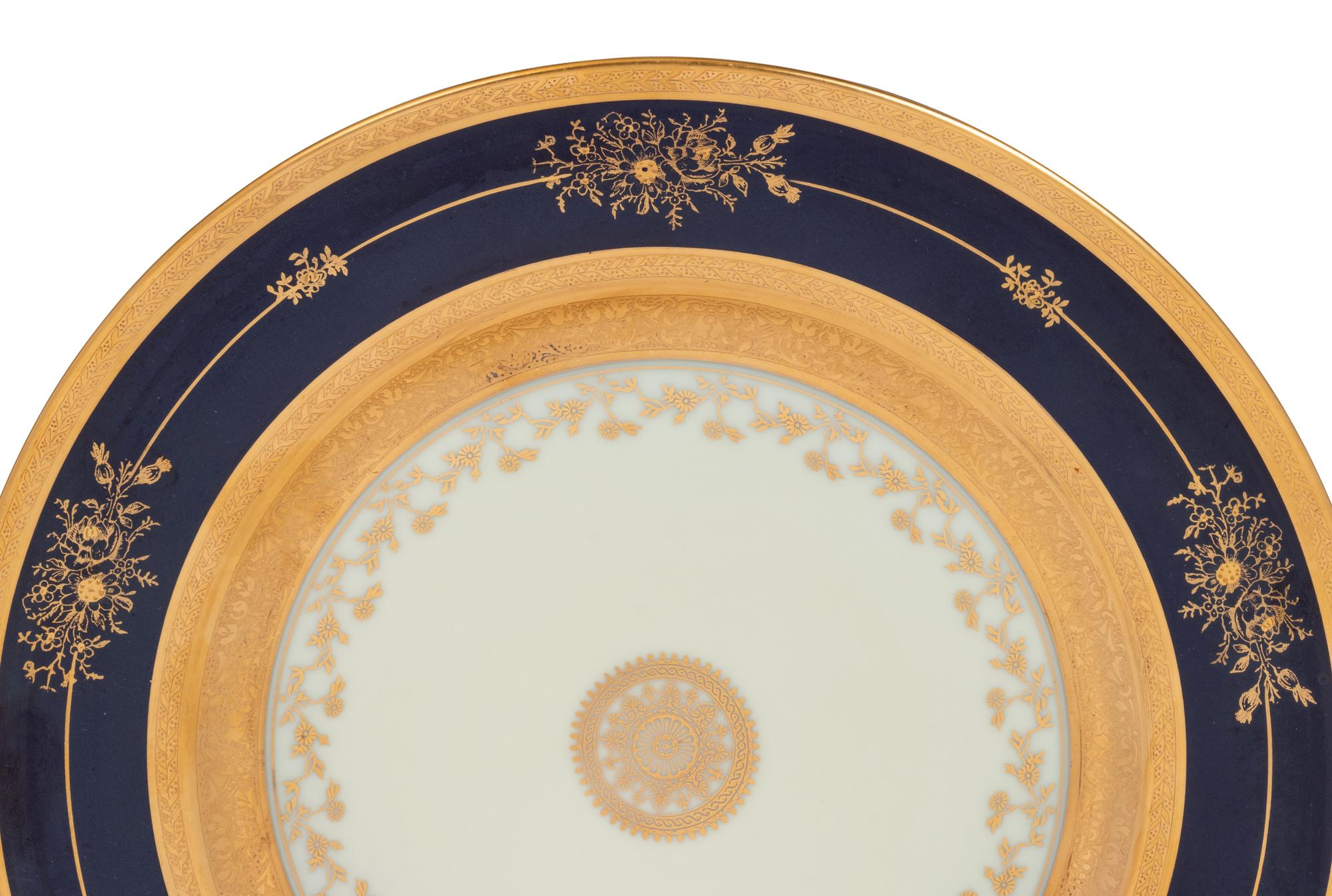 A Set of Twelve Limoges Porcelain Chargers