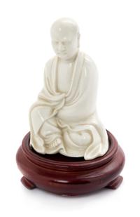 A Chinese Blanc-de-Chine Porcelain Figure of a Luohan Height 4 inches. — QING DYNASTY