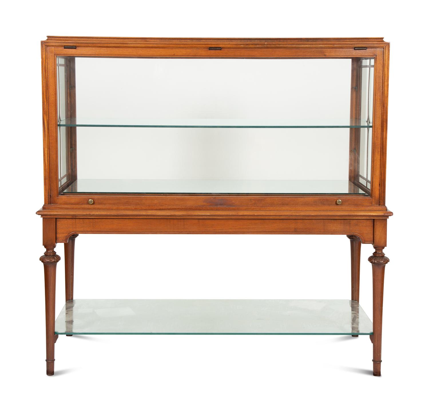 A Regency Style Mahogany Glazed Display Cabinet on Stand