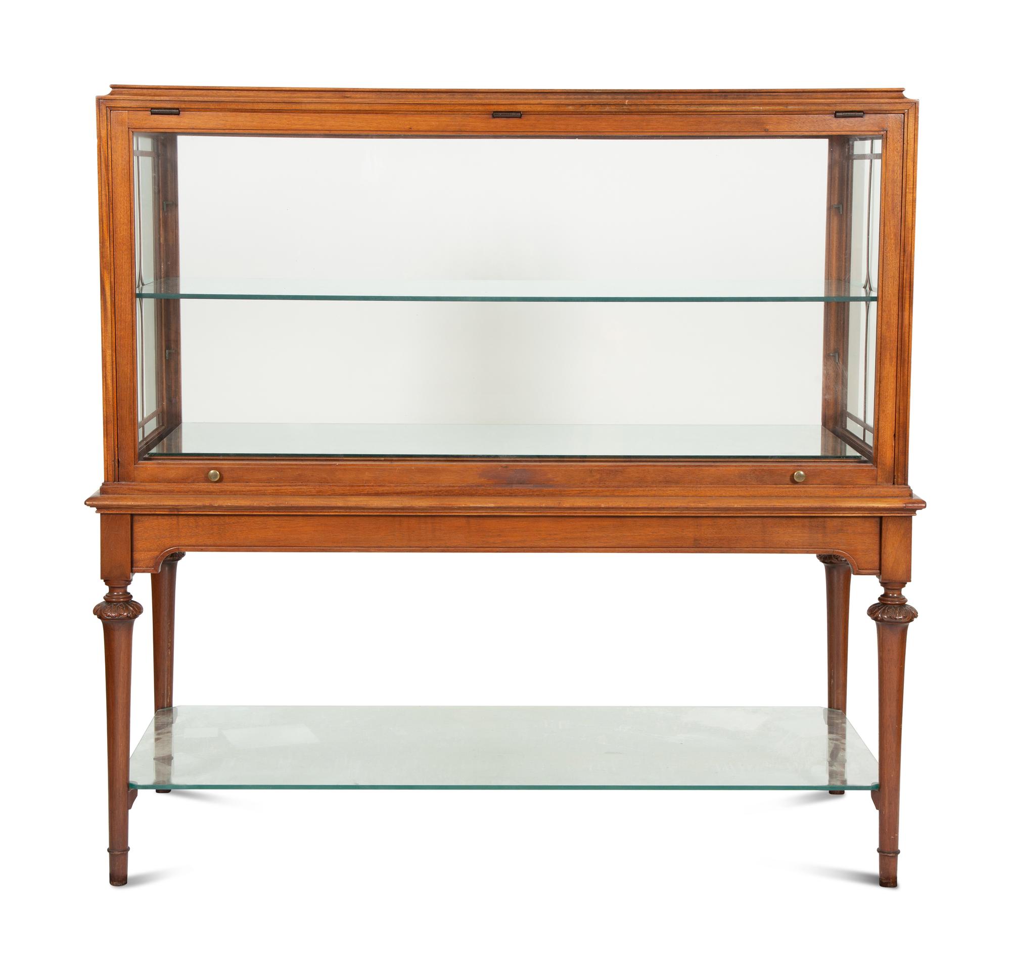 A Regency Style Mahogany Glazed Display Cabinet on Stand