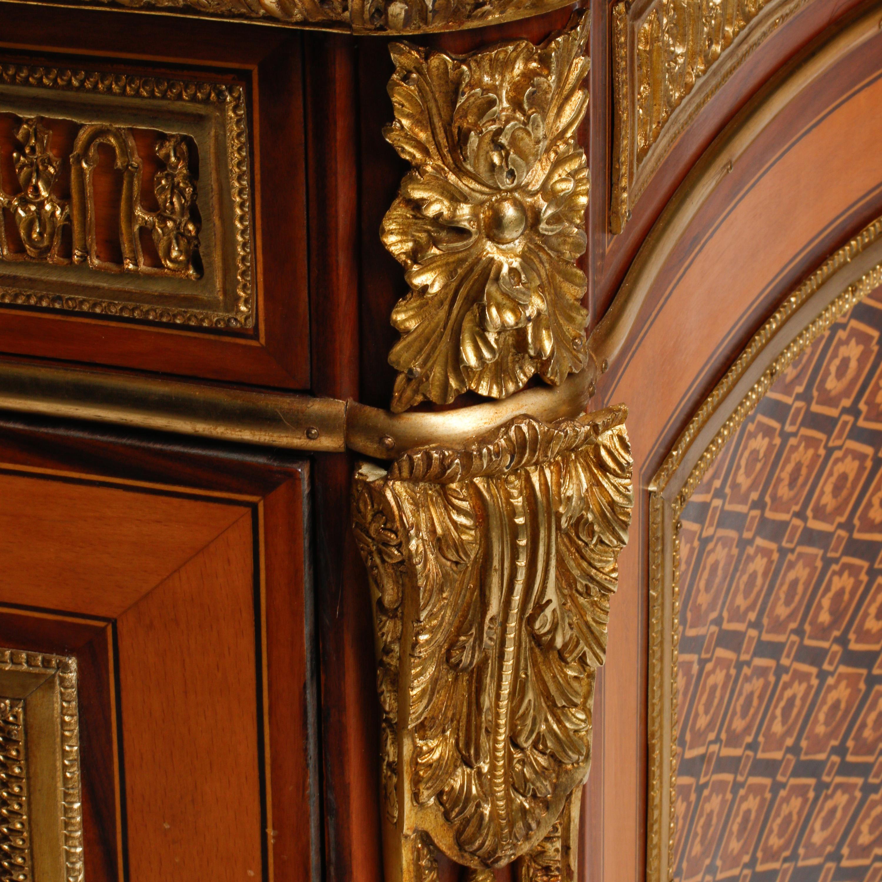A Louis XVI Style Gilt Bronze Mounted Marquetry Marble-Top Commode