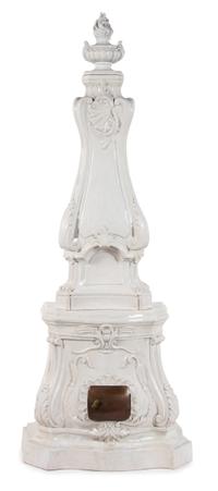 A Continental Rococo Style White Glazed Faience Stove Height 88 x width 35 x depth 20 inches. — 20TH CENTURY