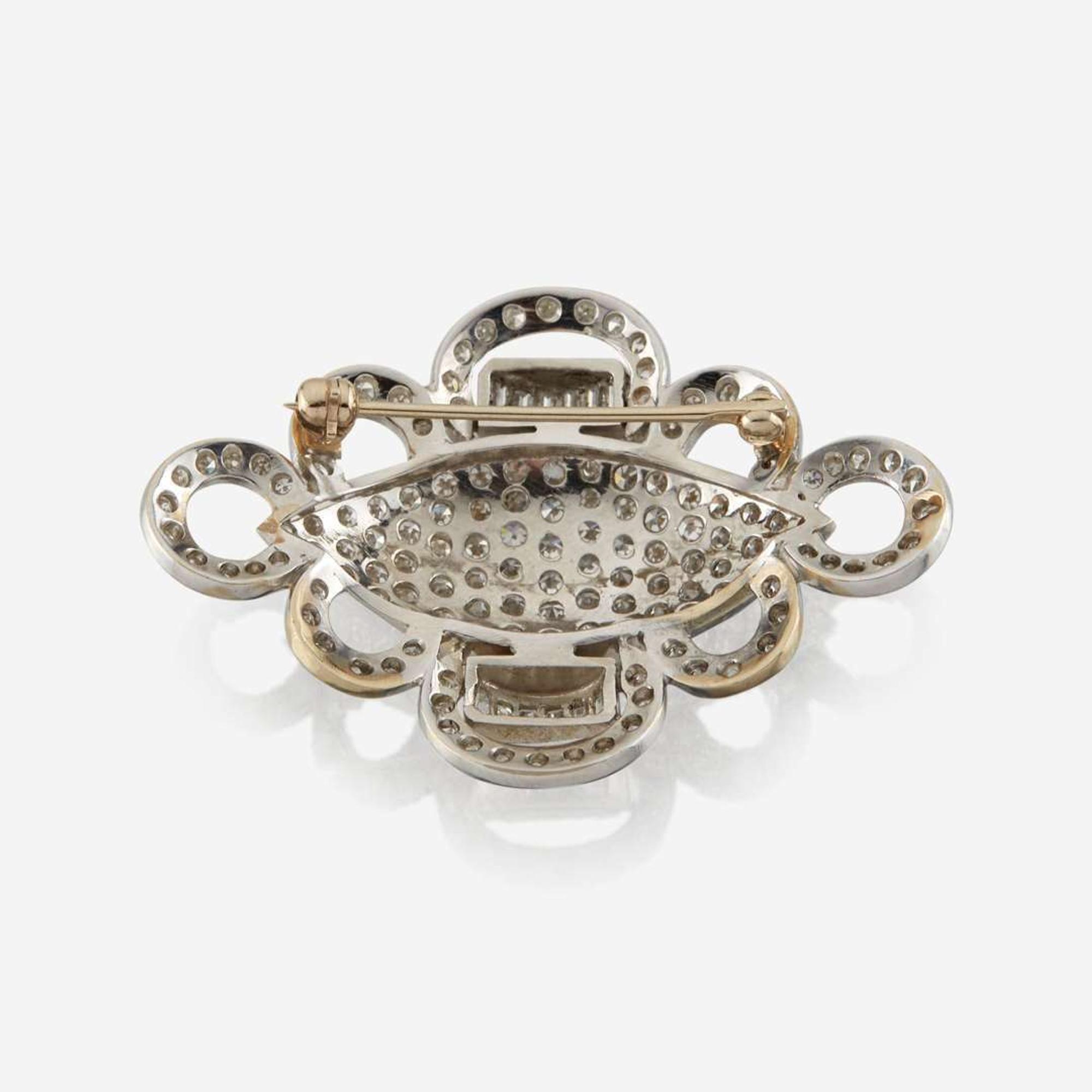 A diamond and white gold brooch