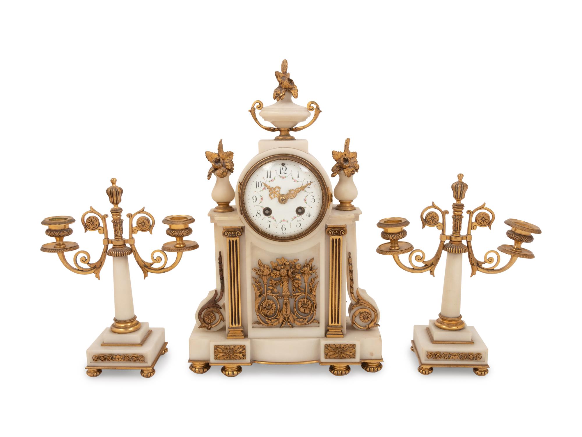 A Louis XVI Style Gilt Bronze Mounted Clock Garniture