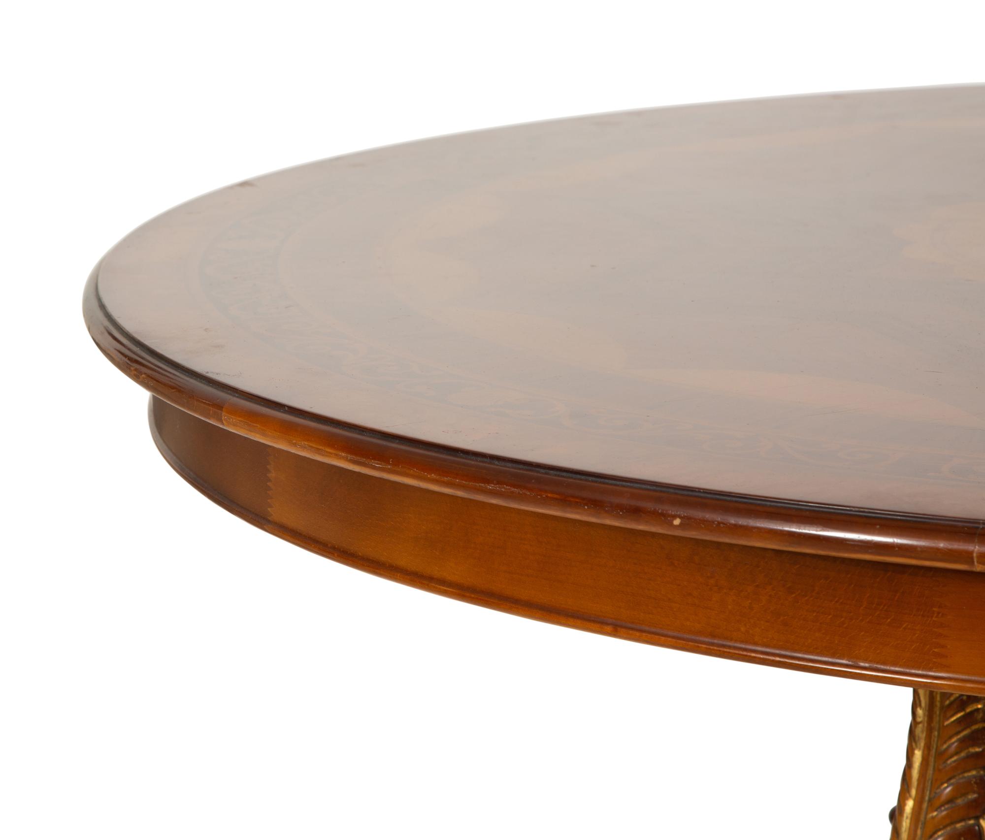 An Empire Style Inlaid Beechwood and Parcel Gilt Center Table by Hurtado