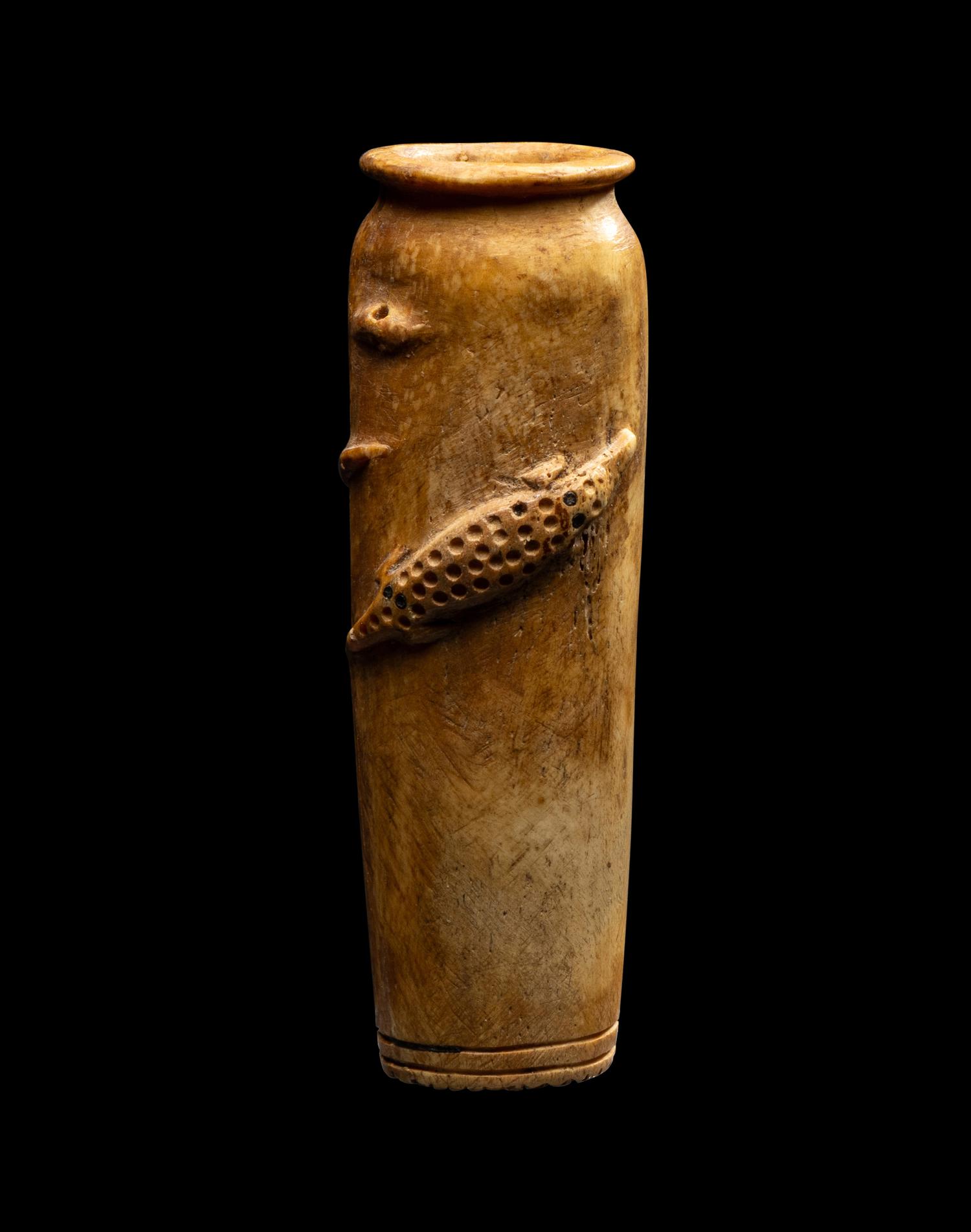 An Egyptian Bone Vase with Crocodiles in Relief