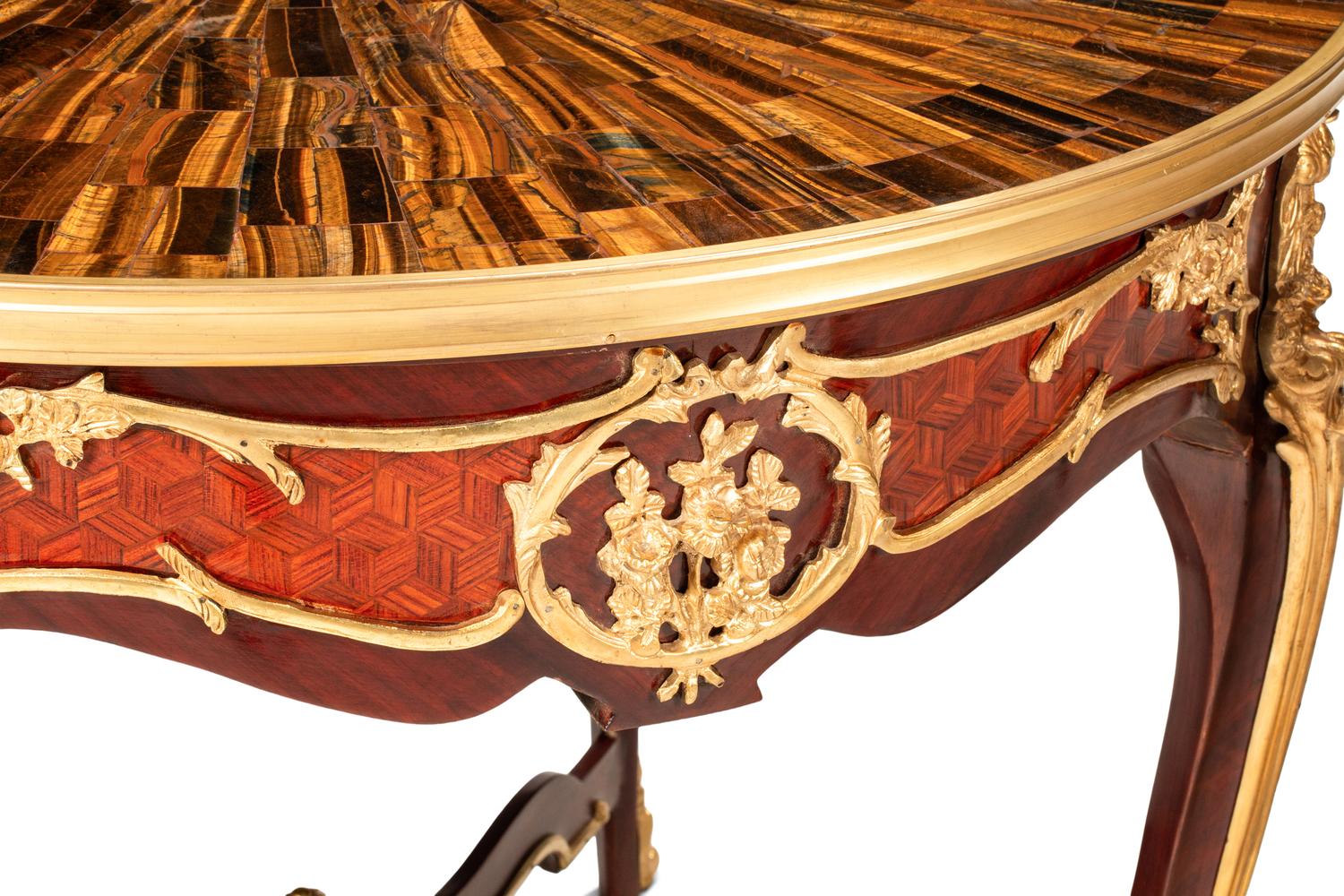 A Pair of Louis XV Style Gilt Bronze Mounted Tables with Tiger's Eye Tops