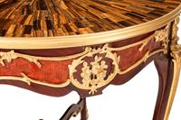 A Pair of Louis XV Style Gilt Bronze Mounted Tables with Tiger's Eye Tops