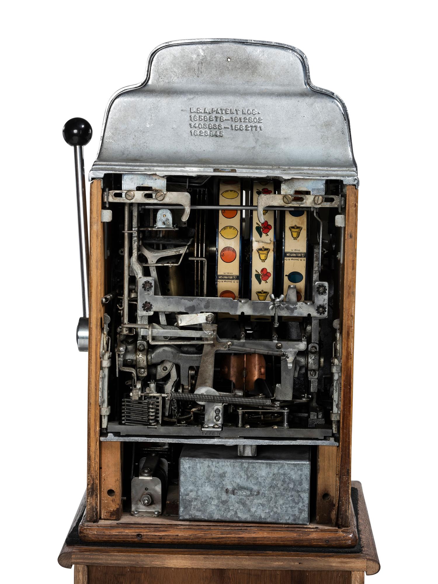 A Silver Dollar Standard Chief Slot Machine on Stand