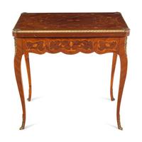 A Louis XV Style Gilt Metal Mounted Marquetry Flip-Top Table
