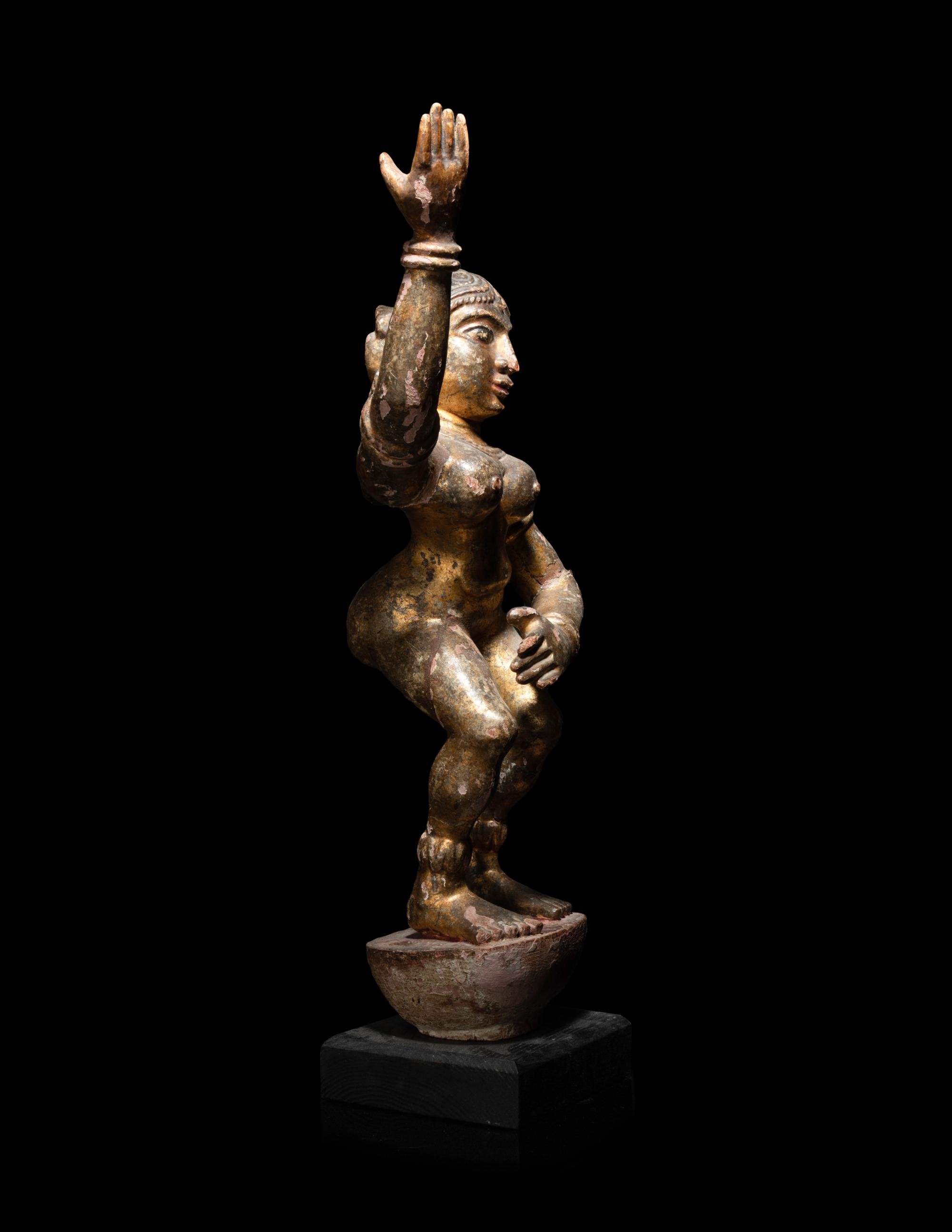 An Indian Gilt Highlighted Carved Wood Dancing Figure