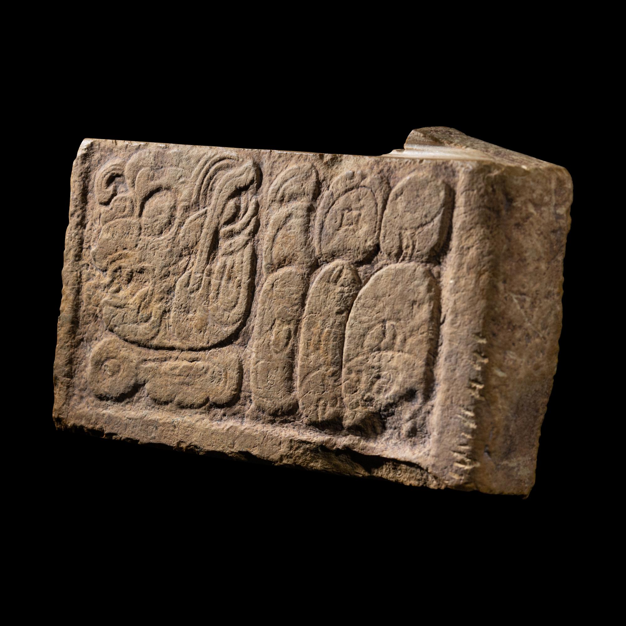 A Maya Limestone Panel with Glyphs