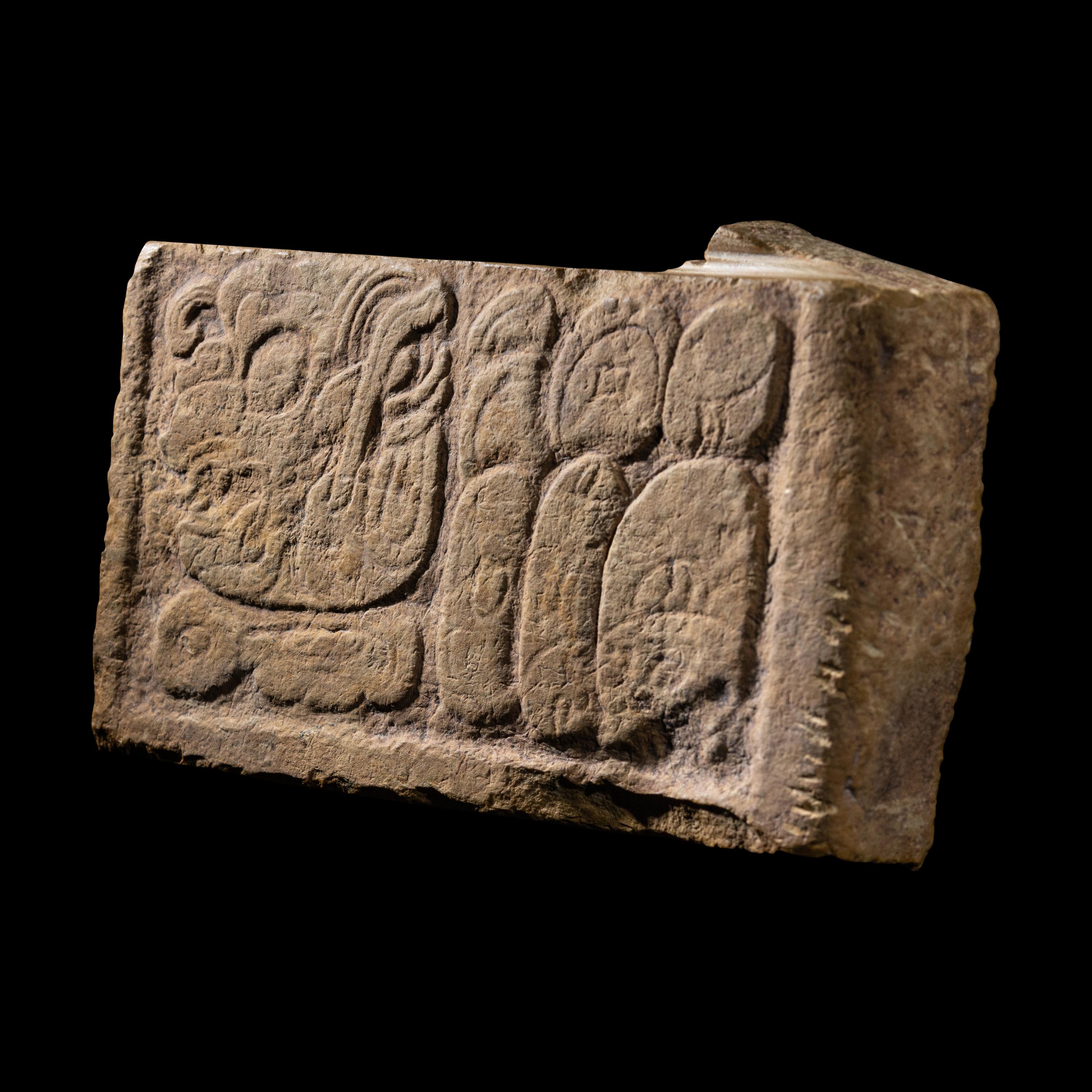 A Maya Limestone Panel with Glyphs