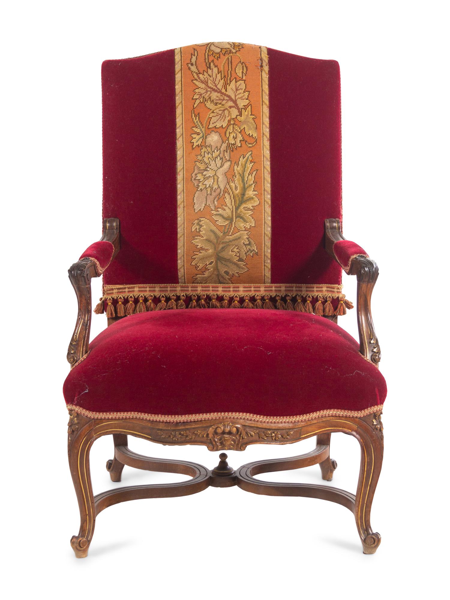 A Pair of Italian Louis XV Style Carved and Parcel Gilt Walnut Fauteuils