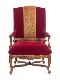 A Pair of Italian Louis XV Style Carved and Parcel Gilt Walnut Fauteuils