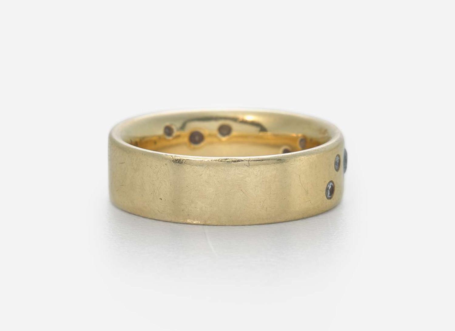 An 18K Yellow Gold Band with Accent Diamonds