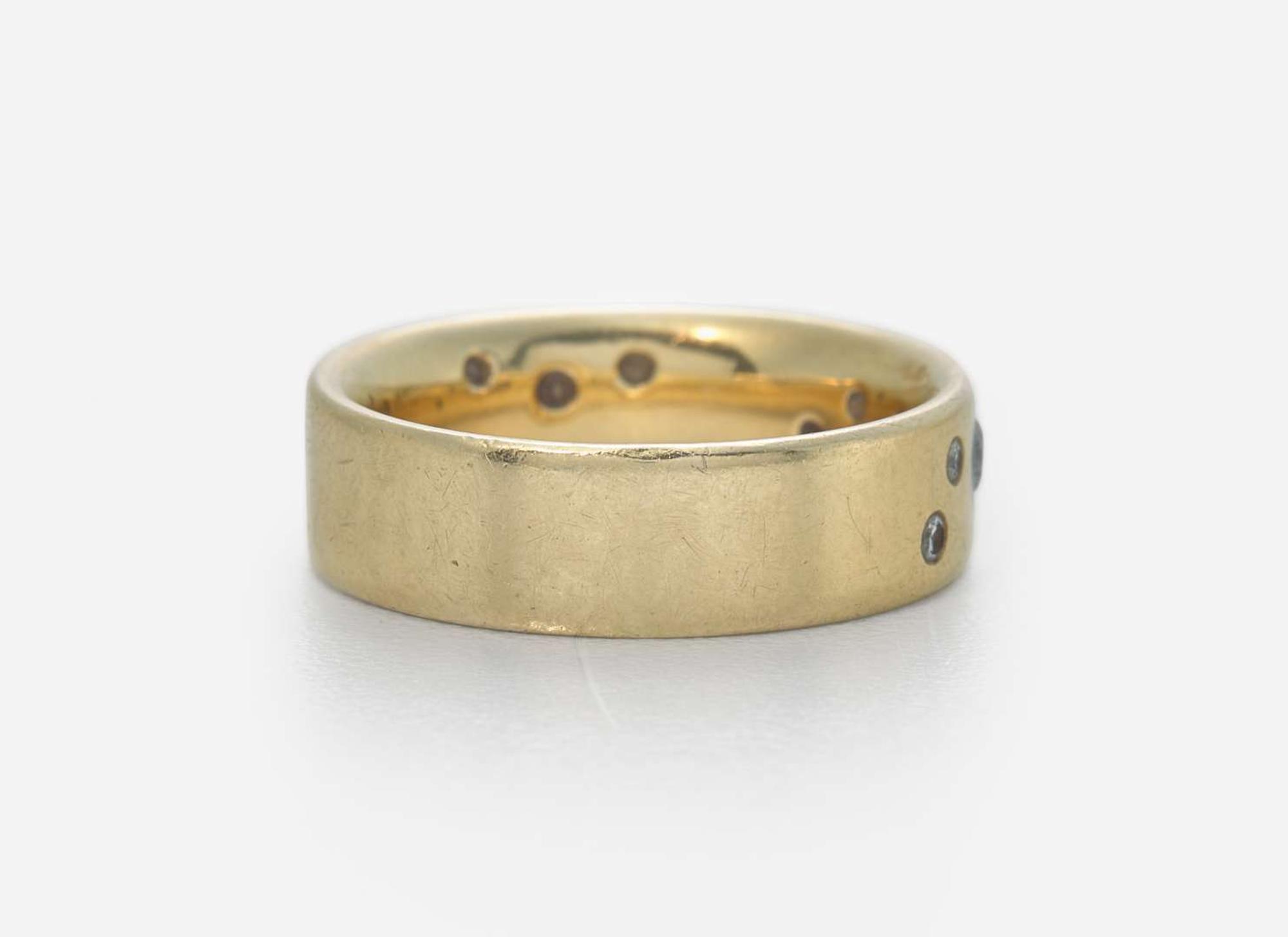 An 18K Yellow Gold Band with Accent Diamonds
