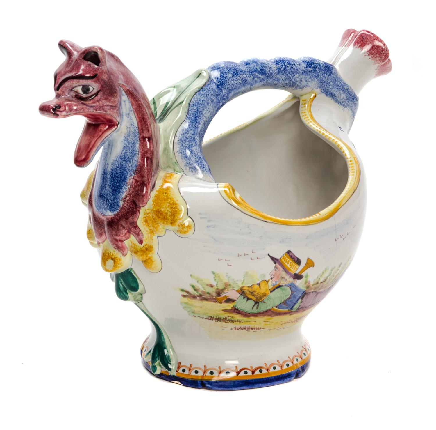 A Quimper Pottery Jug Height 8 3/4 inches.