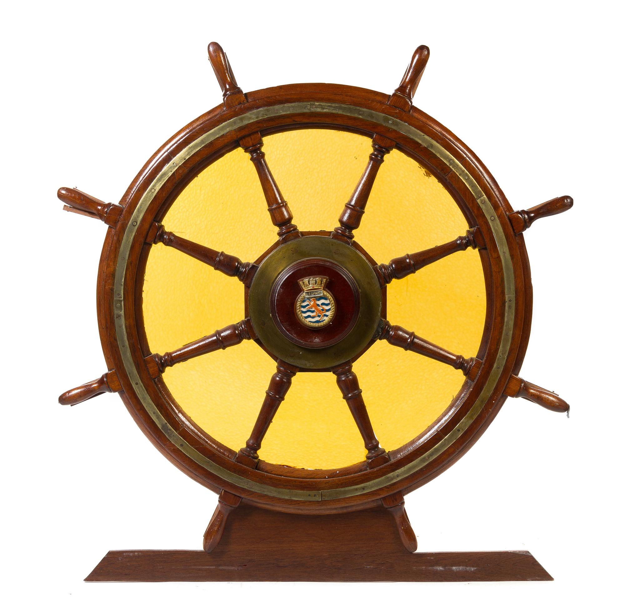 An Ornamental Brass Mounted Oak Ship's Wheel Diameter 53 7/8 inches.