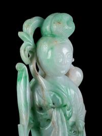 A Chinese Apple Green and Pale Celadon Jadeite Figure of Guanyin