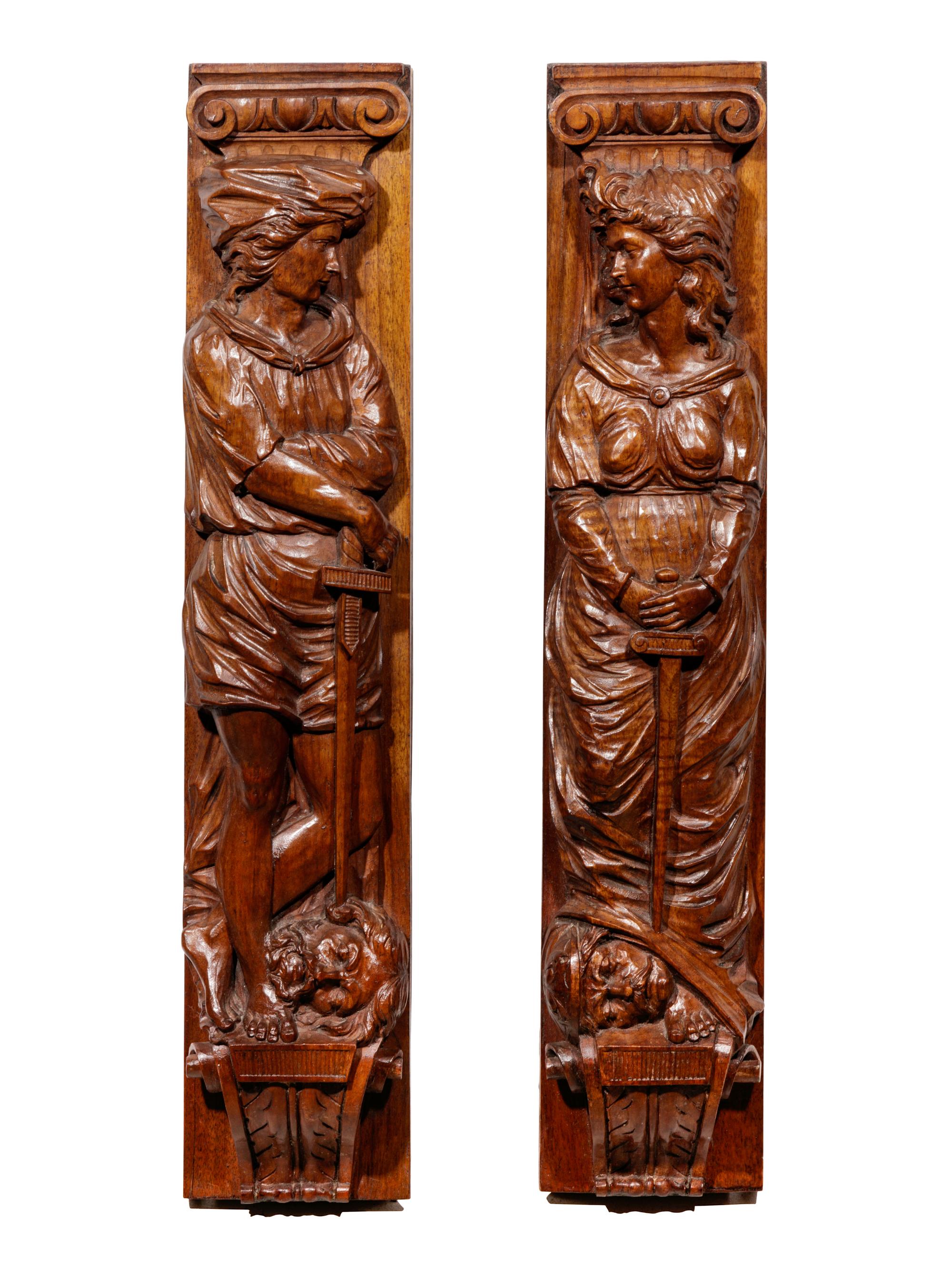 A Pair of Carved Oak Figural Pilasters