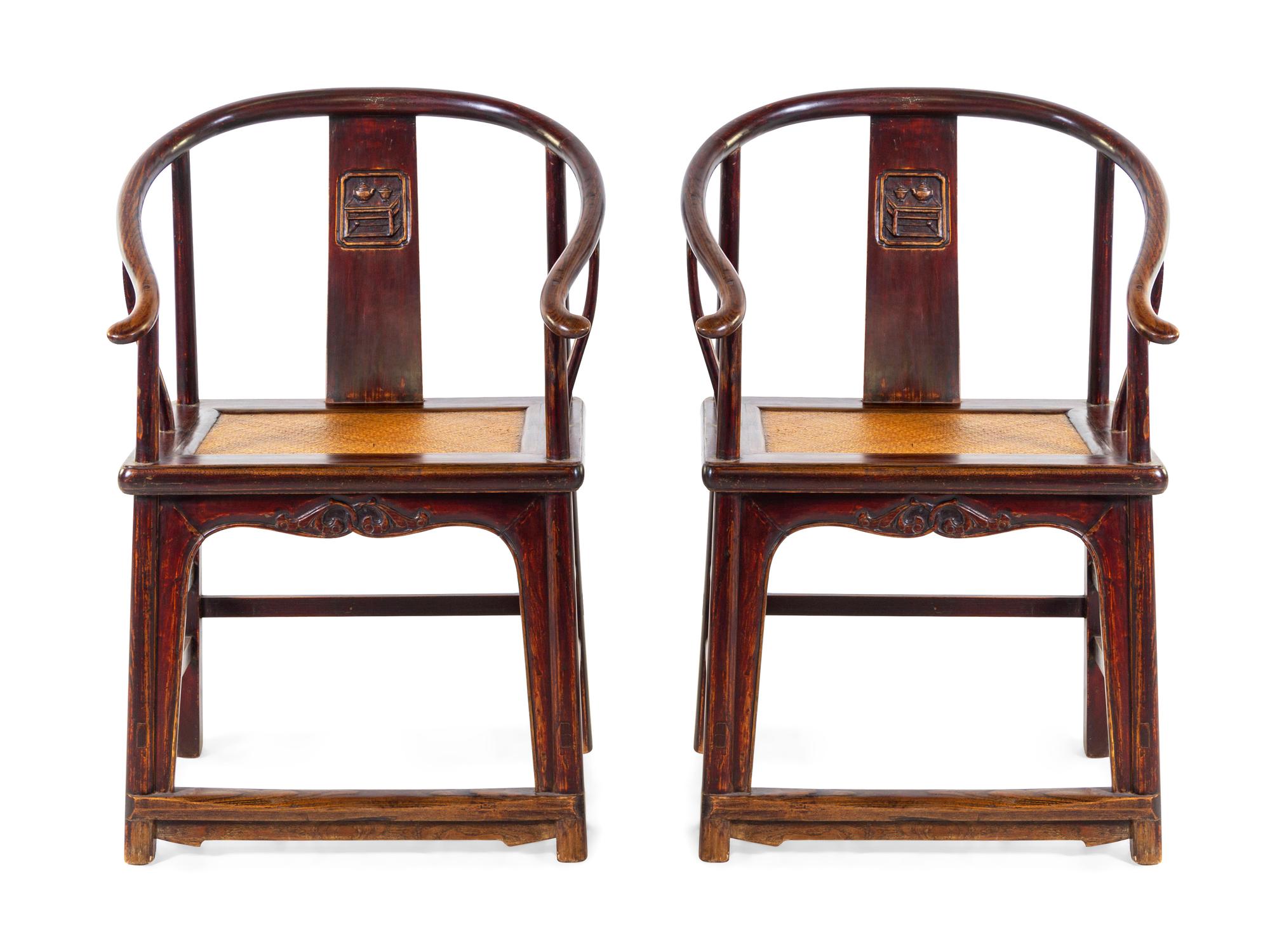 A Pair of Chinese Elmwood Horseshoe-Back Armchairs