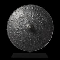 A Victorian Iron Parade Shield with Scenes from the Life of Julius Caesar