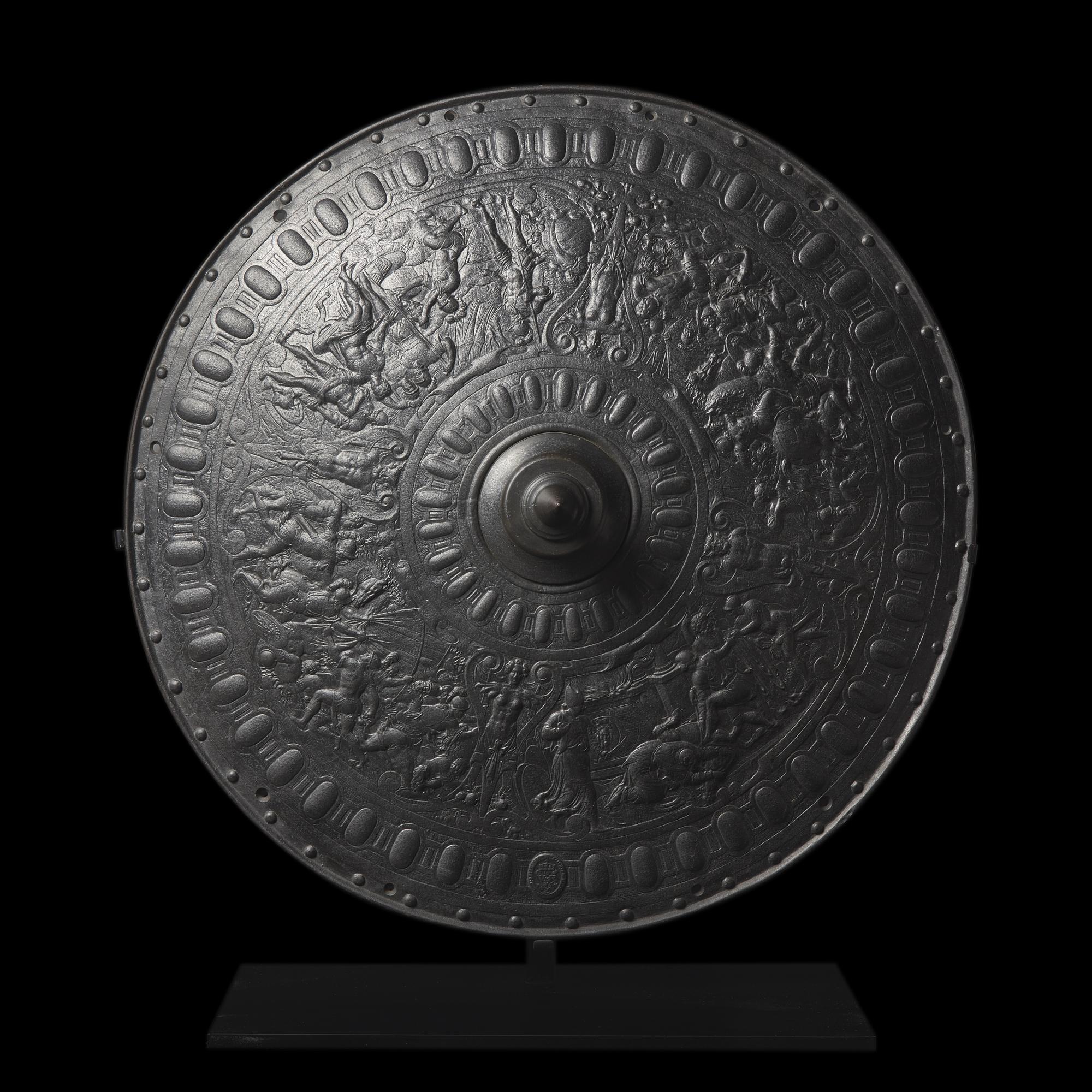 A Victorian Iron Parade Shield with Scenes from the Life of Julius Caesar