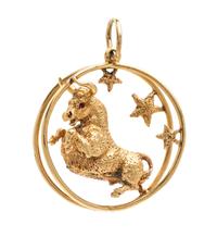 A Yellow Gold and Ruby Taurus Motif Charm, 25.40 dwts.