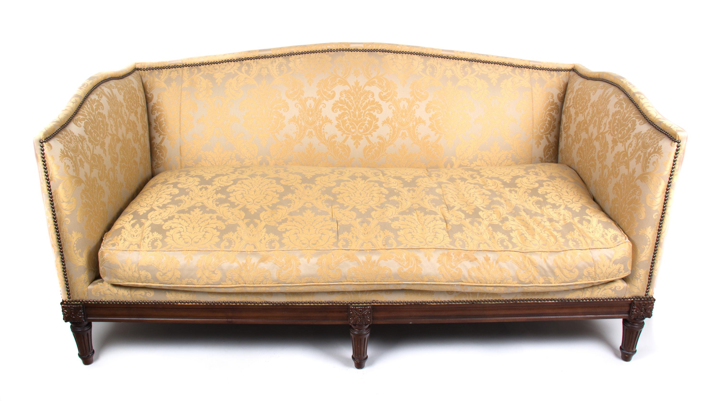 A Neoclassical Style Carved Mahogany and Upholstered Sofa Height 34 x length 72 1/2 x depth 37 inches. — 20TH CENTURY