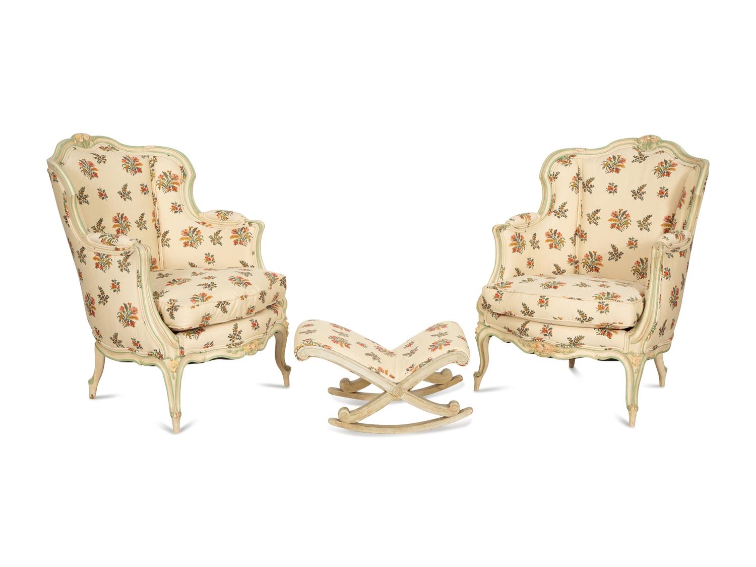 A Pair of Louis XV Style Painted Wingback Bergères and an Associated Stool