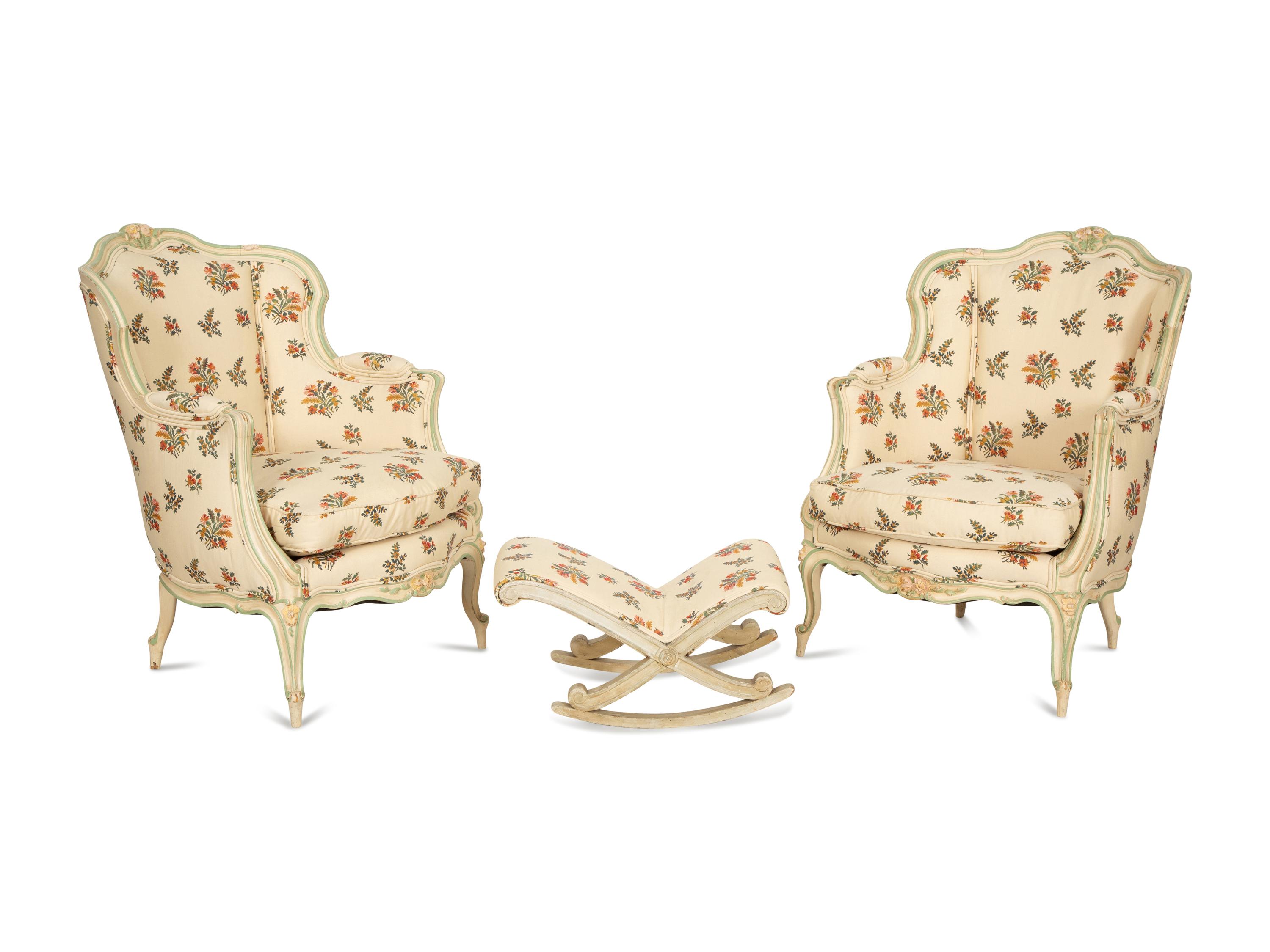 A Pair of Louis XV Style Painted Wingback Bergères and an Associated Stool