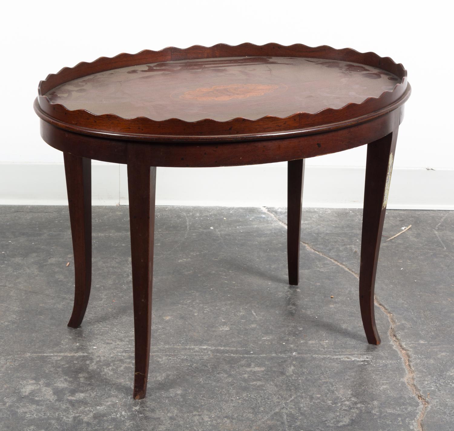 An Oval Low Table Height 19 3/4 x width 26 3/4 x depth 19 1/4 inches.