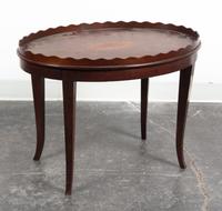 An Oval Low Table Height 19 3/4 x width 26 3/4 x depth 19 1/4 inches.